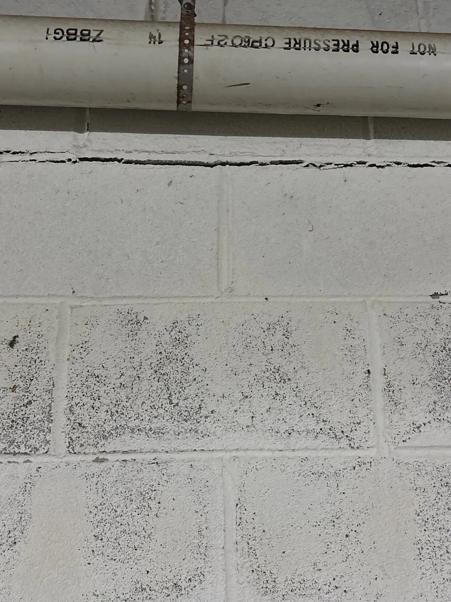 A bowing wall with seperation at the top of the wall in the basement of a Home in Pinson Alabama.