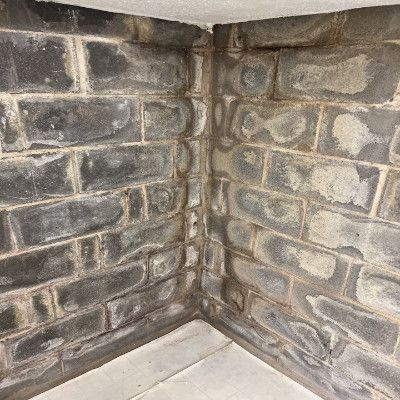 Efflorescence on walls indicating waterproofing need.