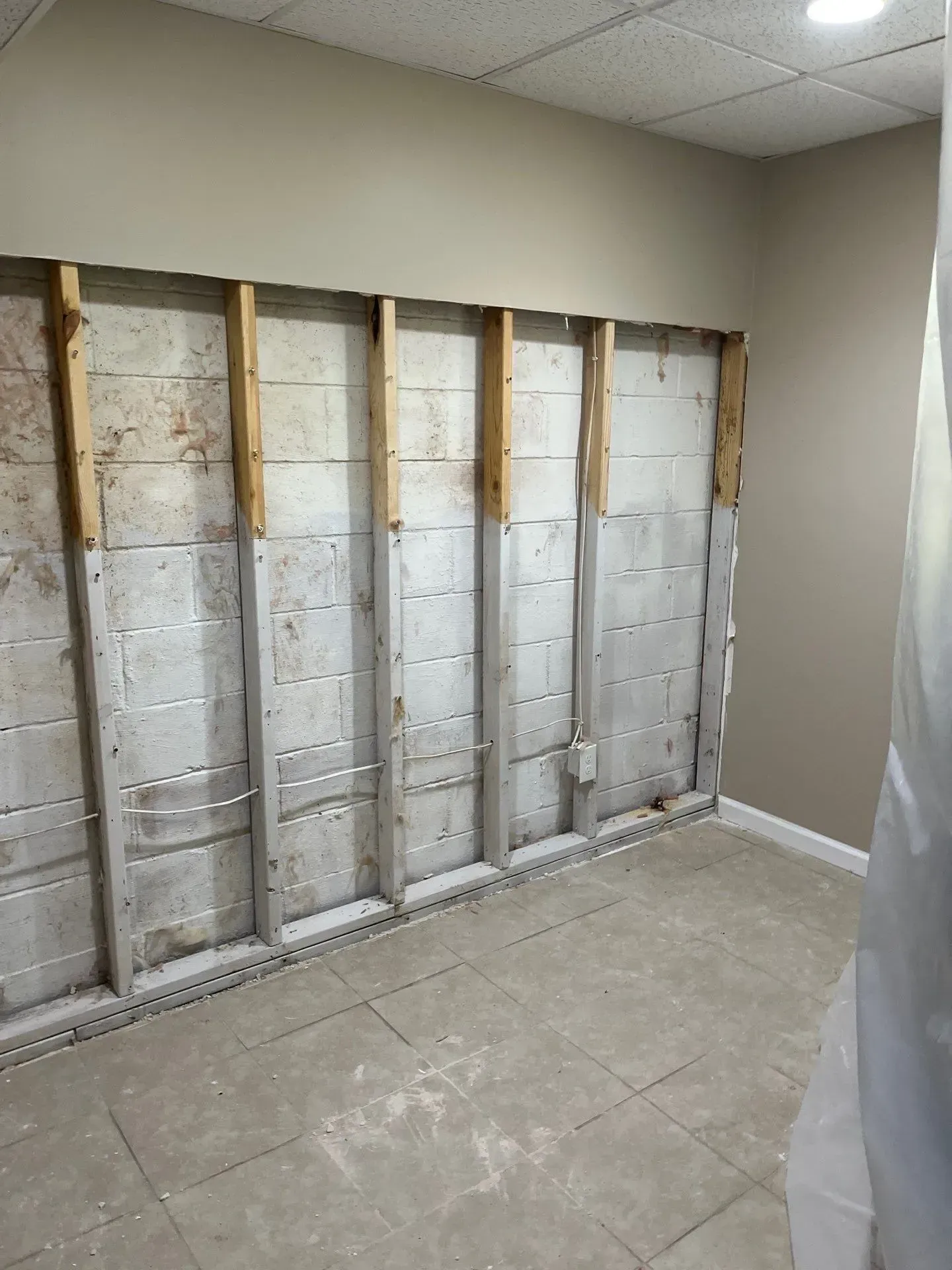 This basement in Hoover, AL had basement water damage and needed waterproofing. Before waterproofing.