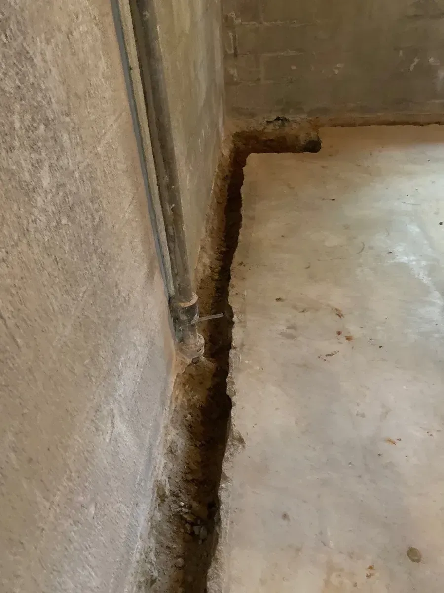 In Mountain Brook, AL installing Basement Waterproofing System done by H2O Waterproofing