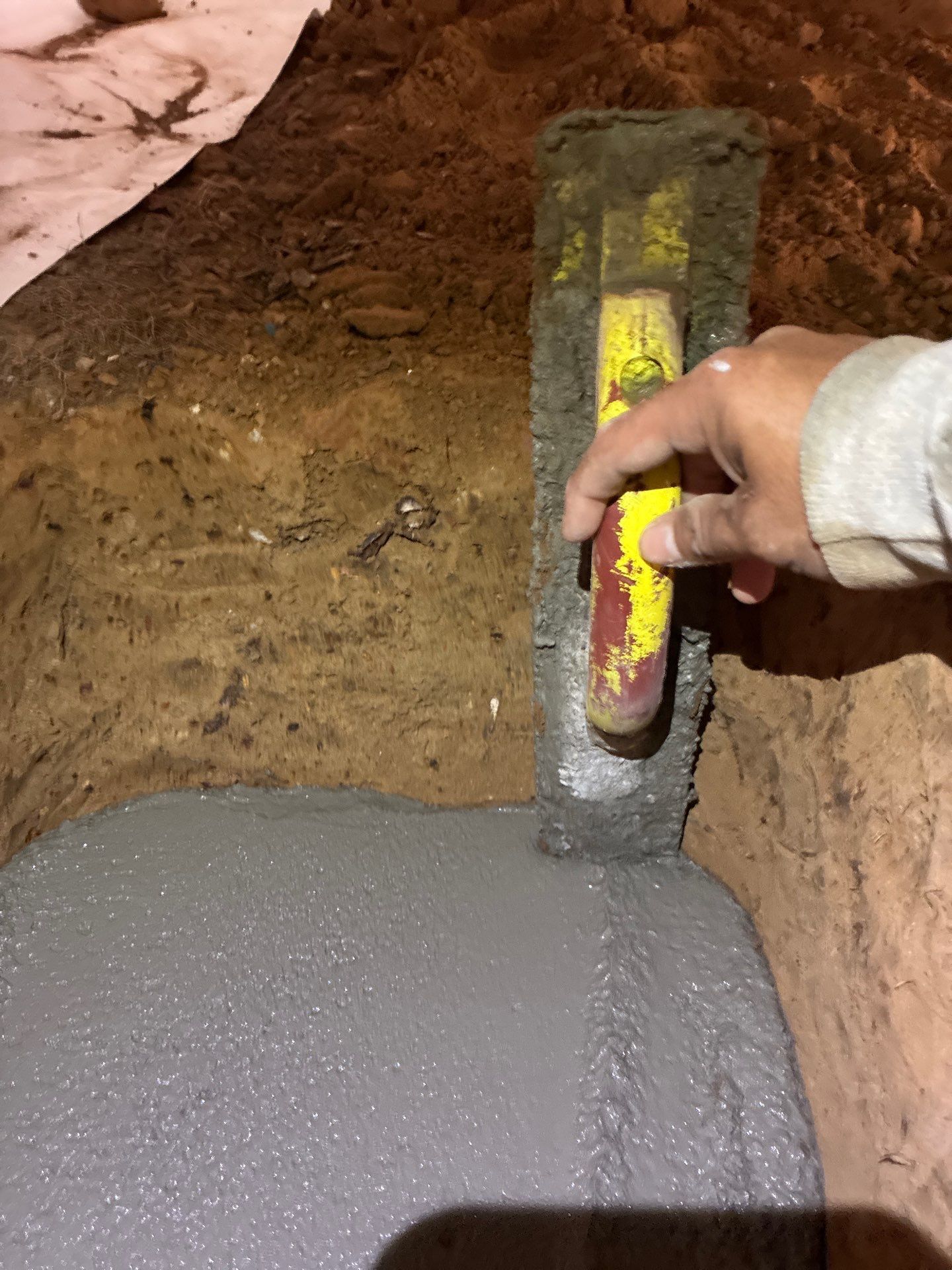 H2O Waterproofing installing a concrete footer for a new crawl space stabilizer