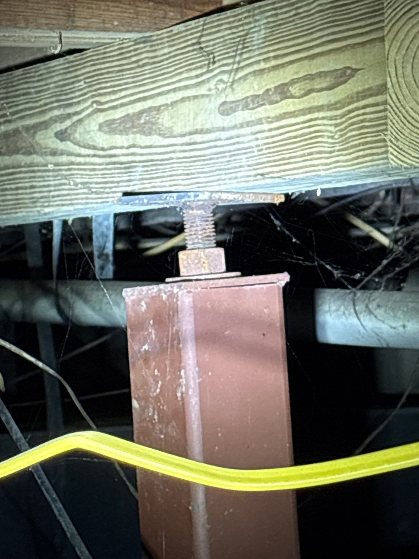 Failing crawl space stabilizer beneath the home's floor system before replacement