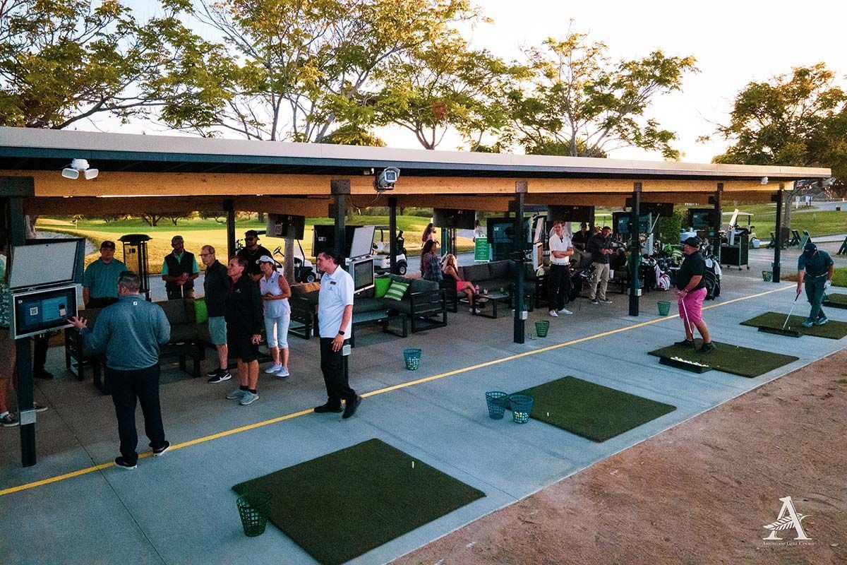A group of people are playing golf at a golf course