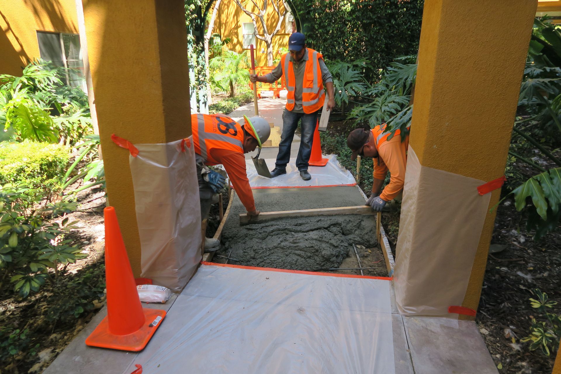 A man wearing an orange vest with the number 35 on it