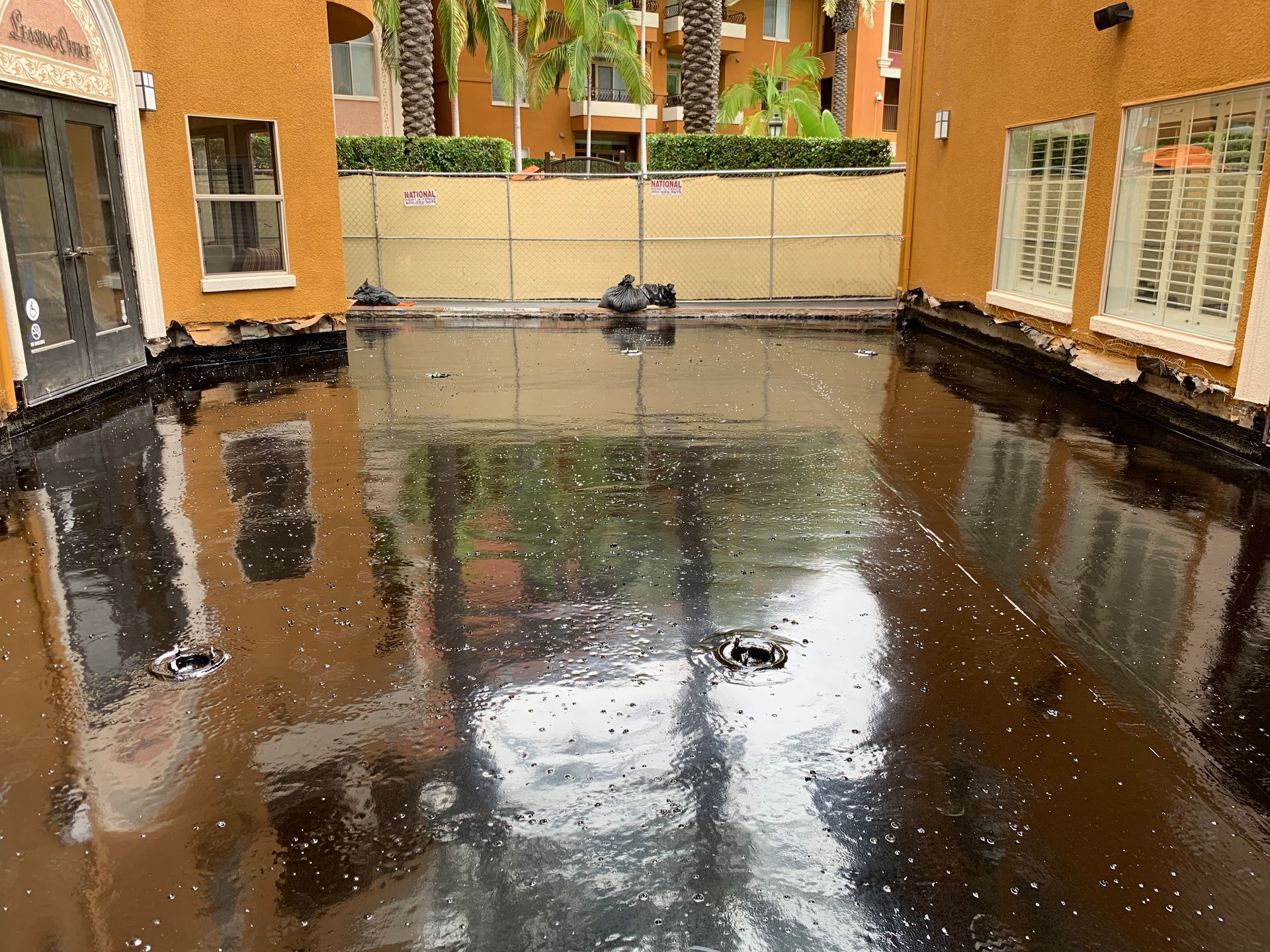 A building with a pool of water in front of it