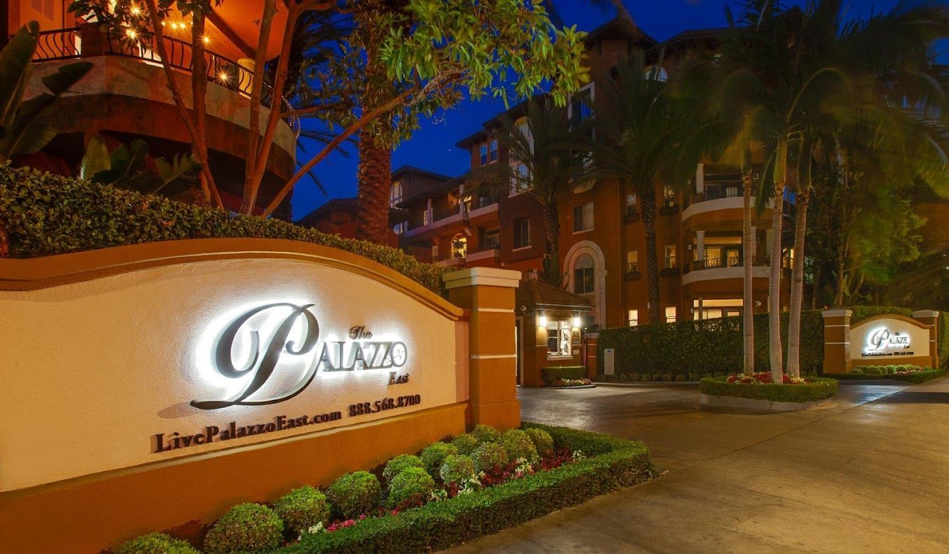 A large building with a sign in front of it that says palazzo.
