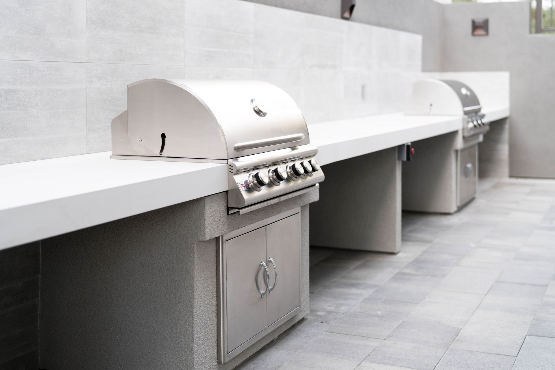 A row of stainless steel grills with the number 1 on them