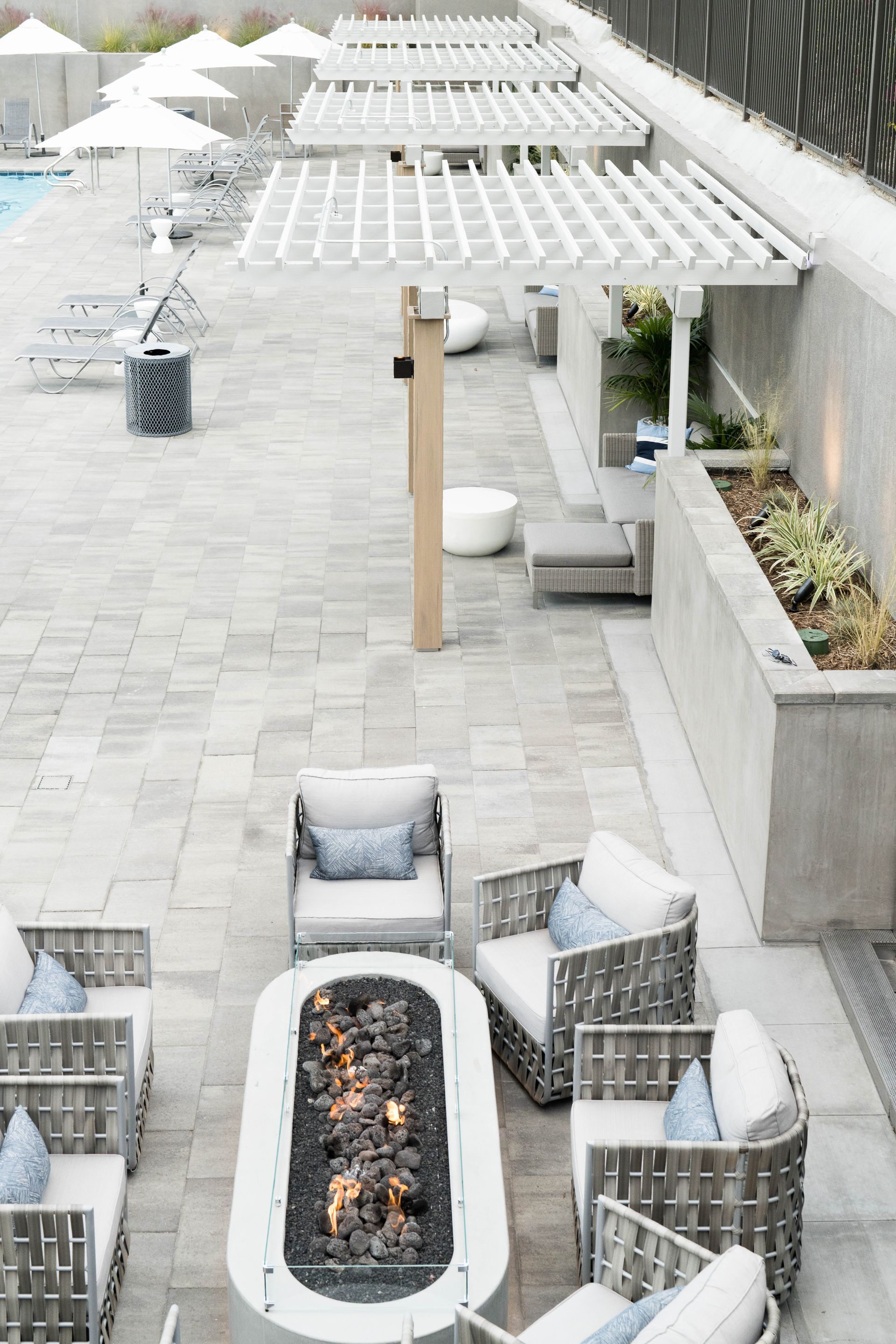 There is a fire pit in the middle of the patio.