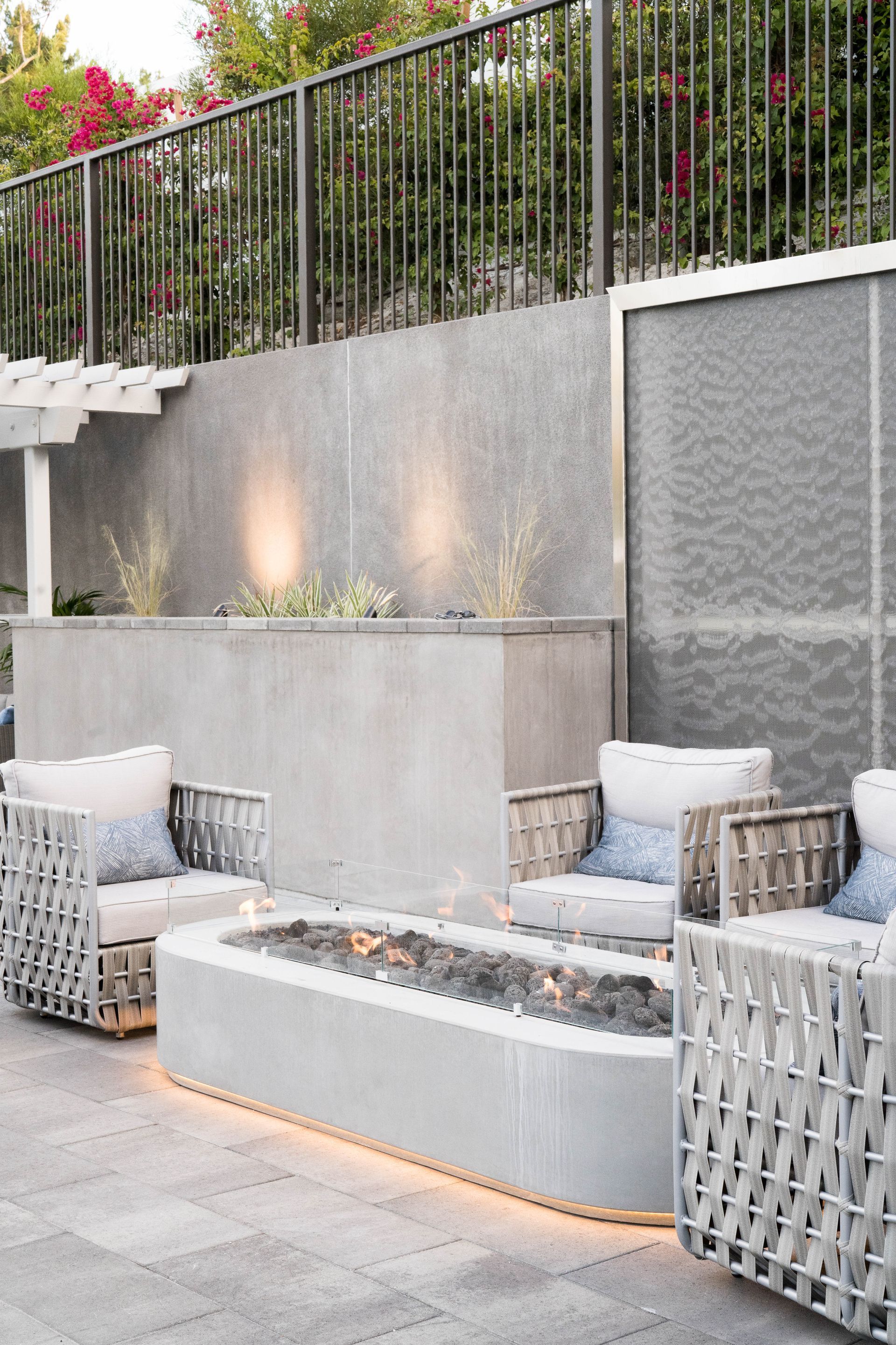 There is a fire pit in the middle of the patio.