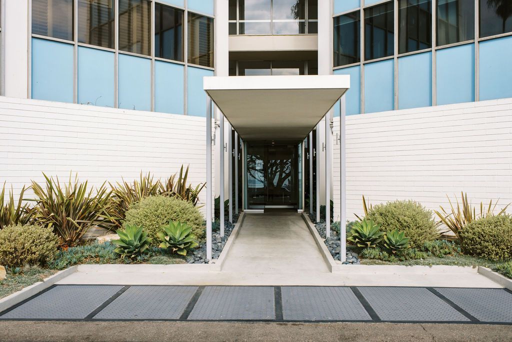 The entrance to a building with a canopy over it
