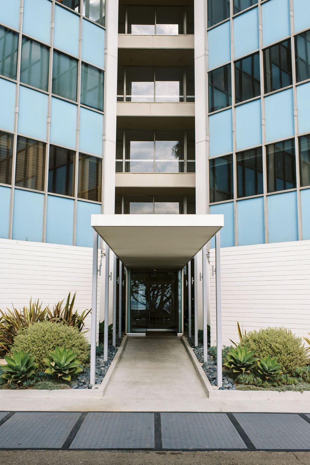 A large building with a ramp leading to the entrance