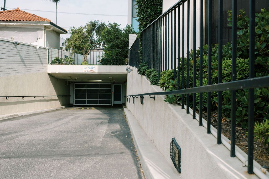 A parking garage with a ramp leading up to it
