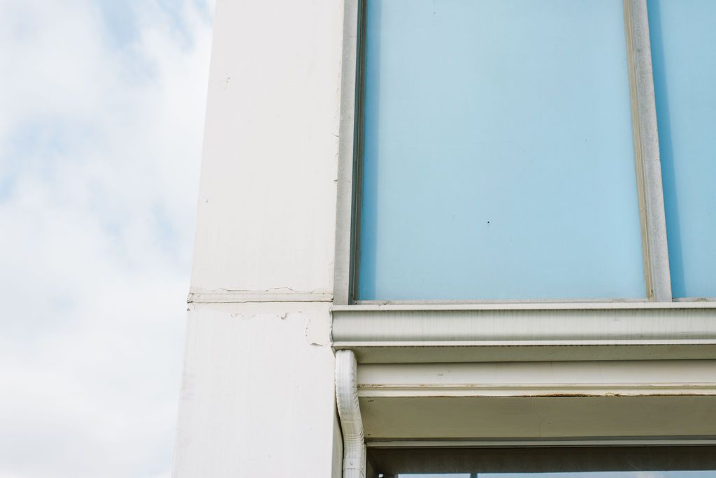 A close up of a building with a blue sky in the background.