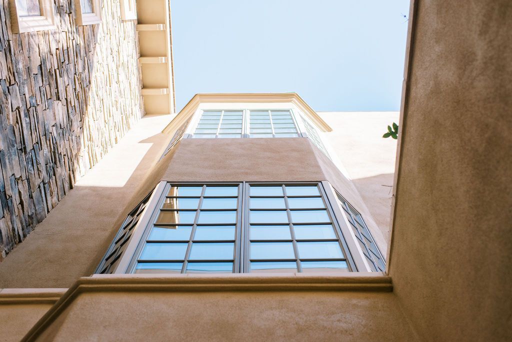 Looking up at a building with a blue sky in the background