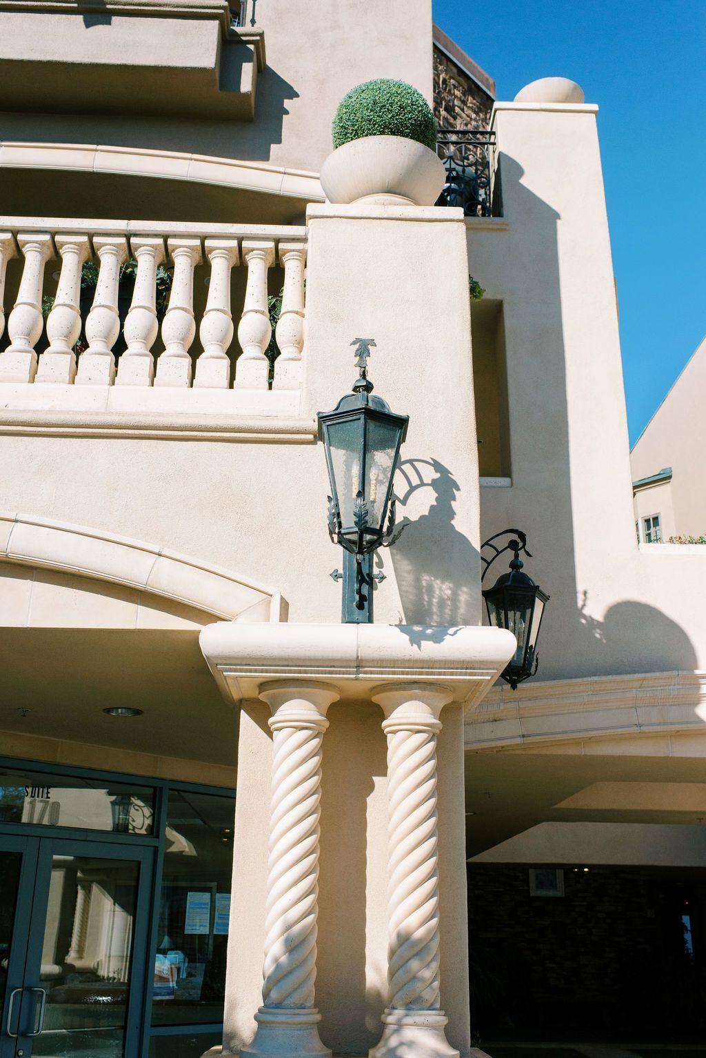 A building with a lamp on the side of it