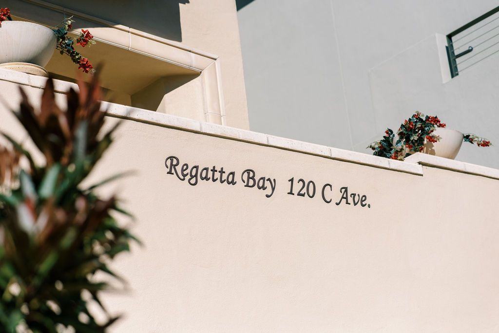 Regatta bay 120 c ave is written on the side of a building