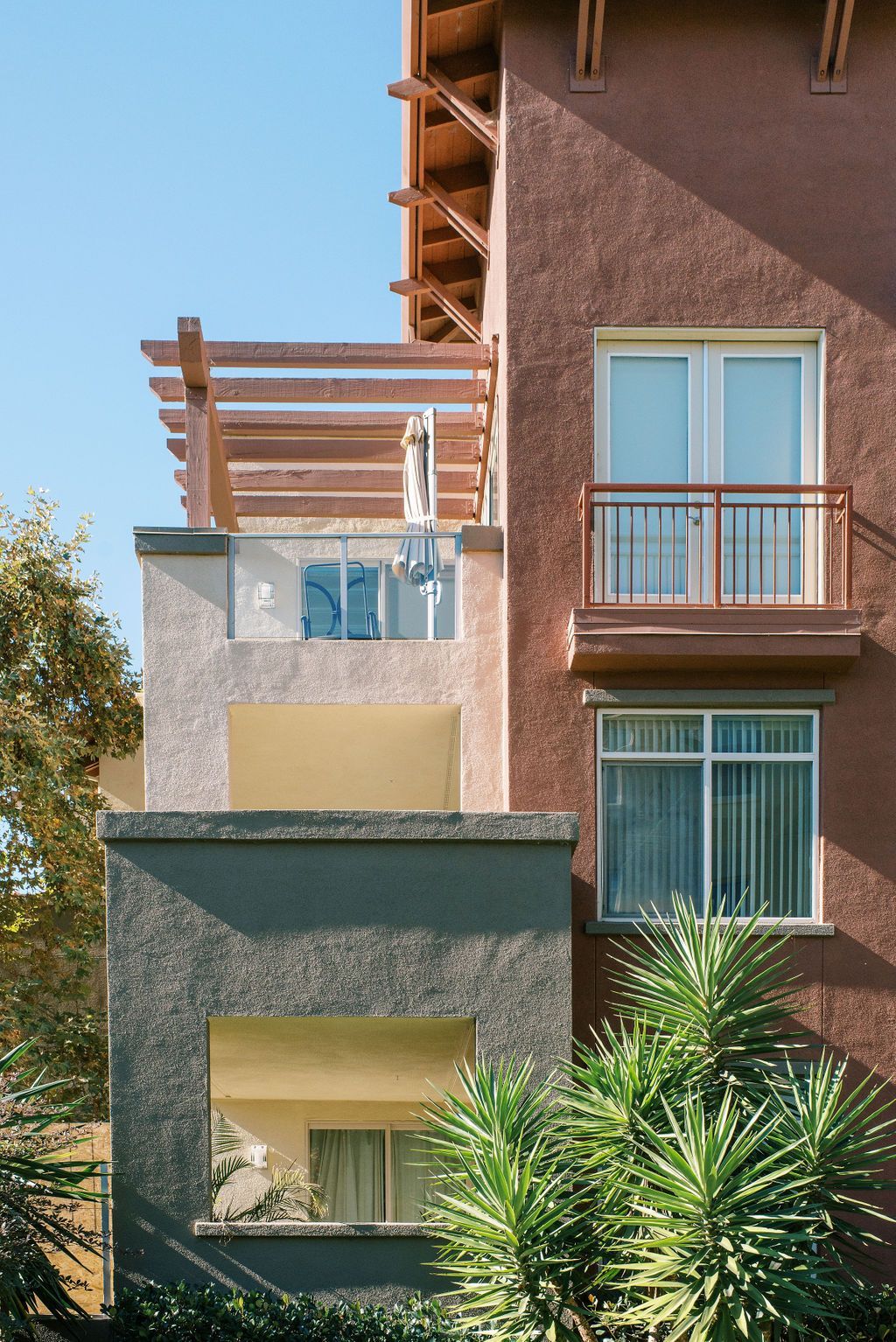 A building with a balcony on the top of it