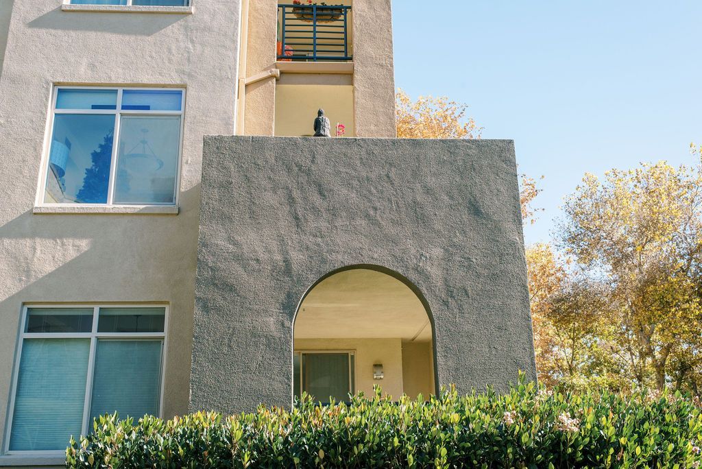 A building with a balcony on the top of it