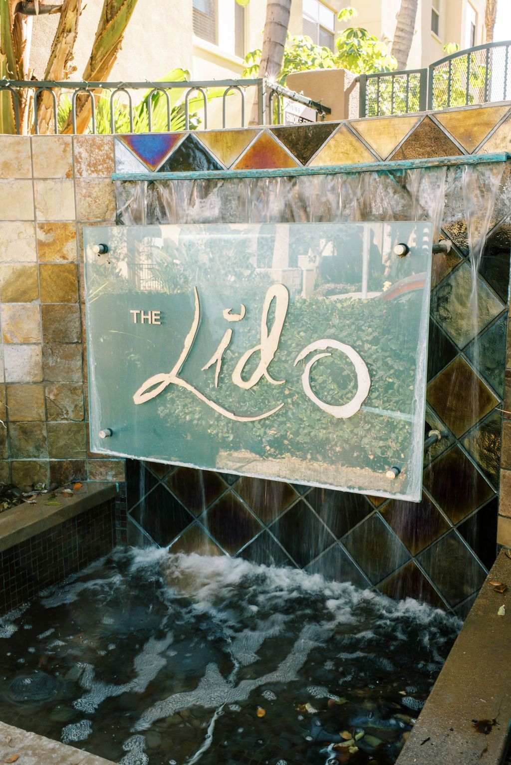 A waterfall with a sign that says the lido on it
