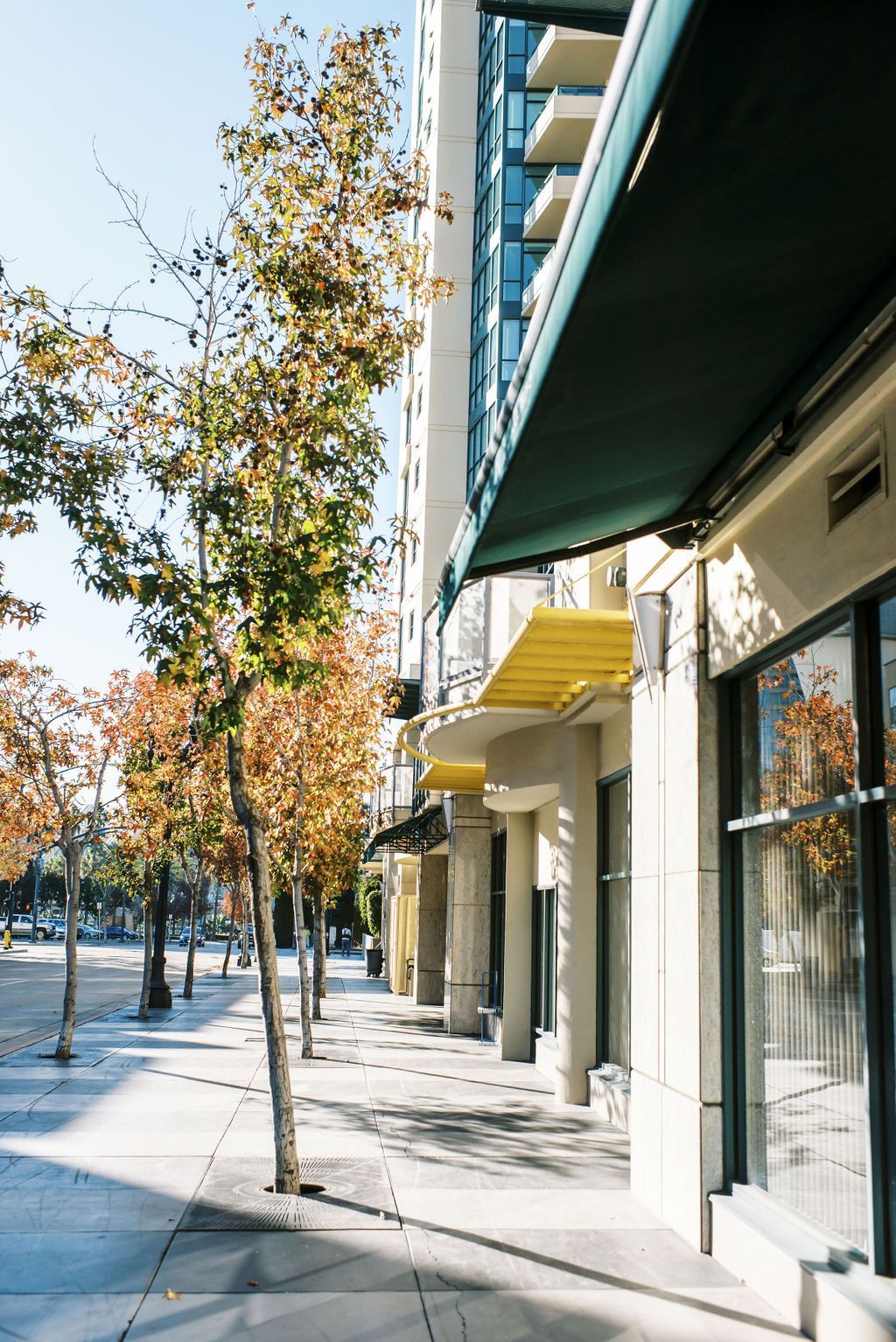 A building with a yellow awning on the side of it