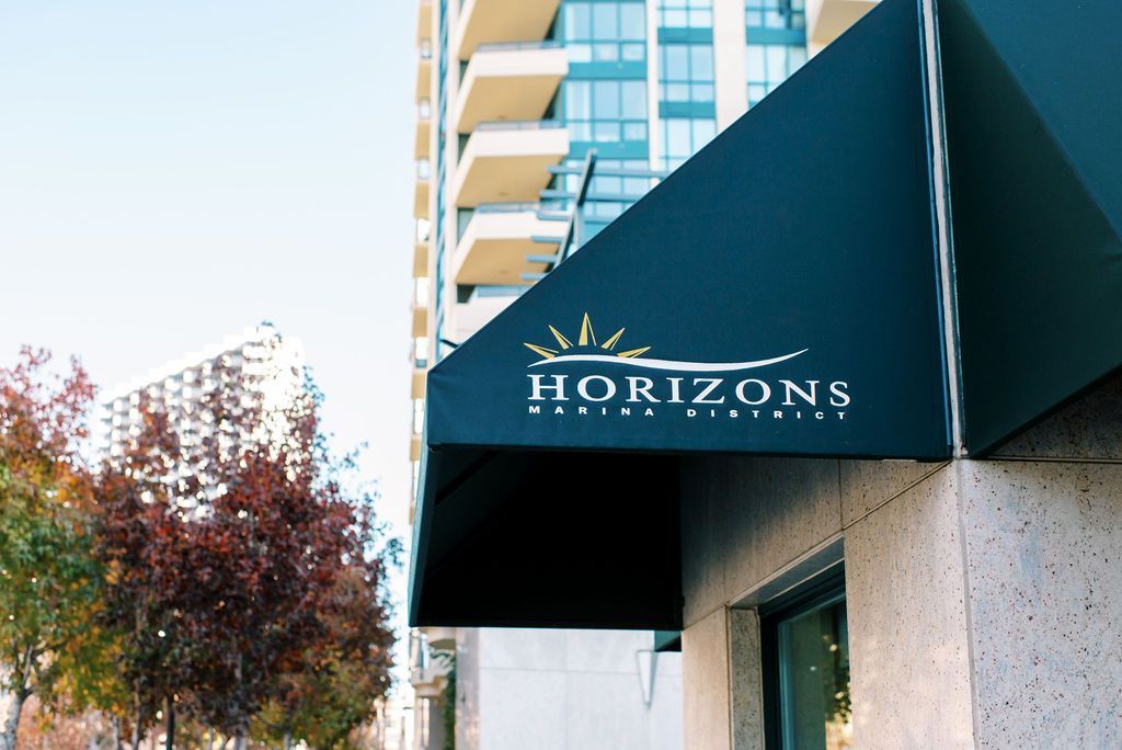 A black awning with the word horizons on it
