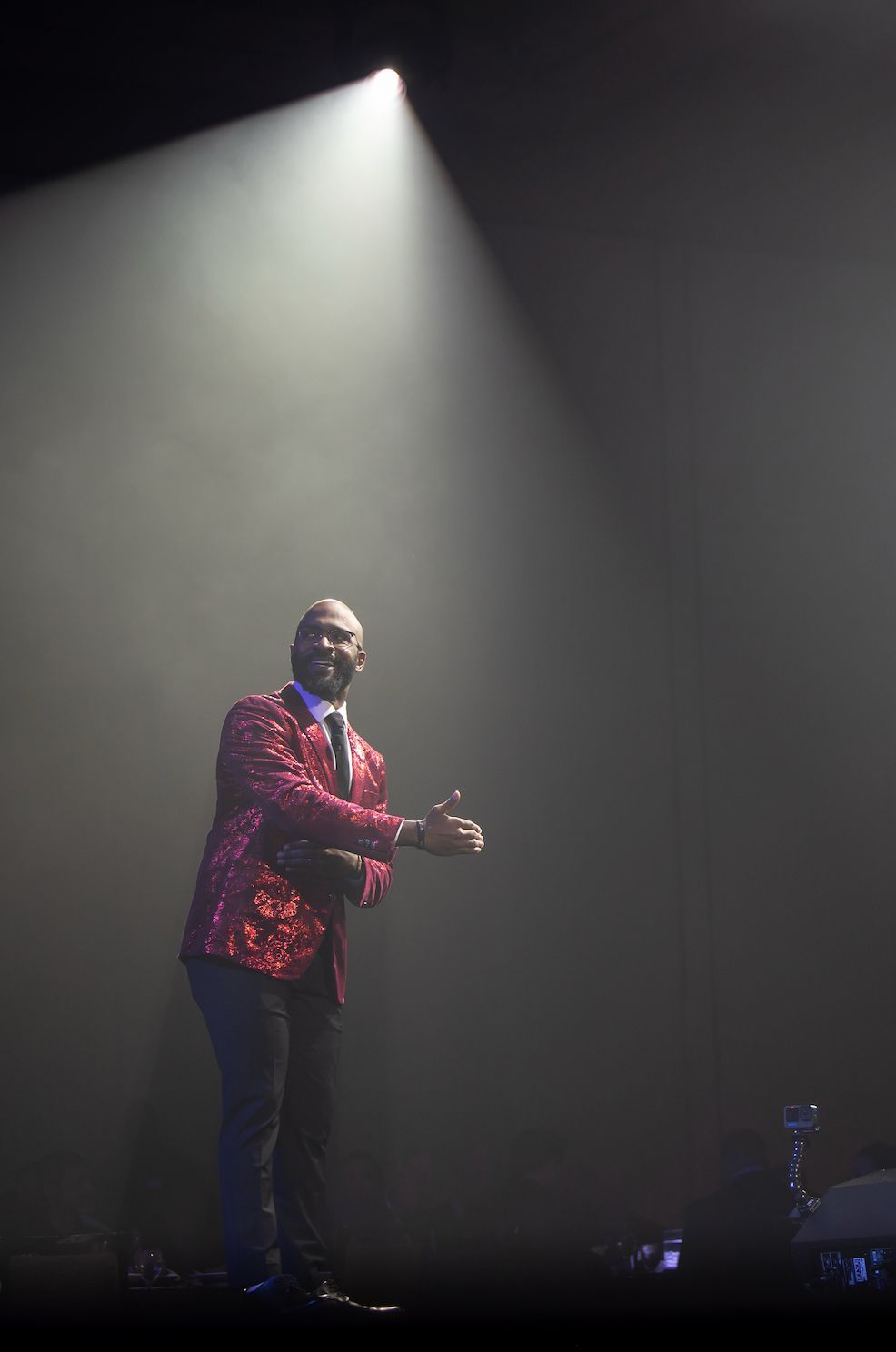 Professional stage lighting highlighting a keynote speaker during a live corporate event production.