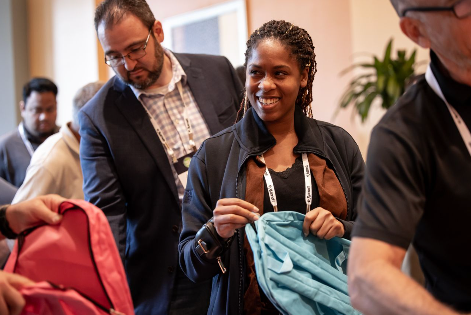 Professional event photography capturing authentic attendee interactions during a corporate conference.