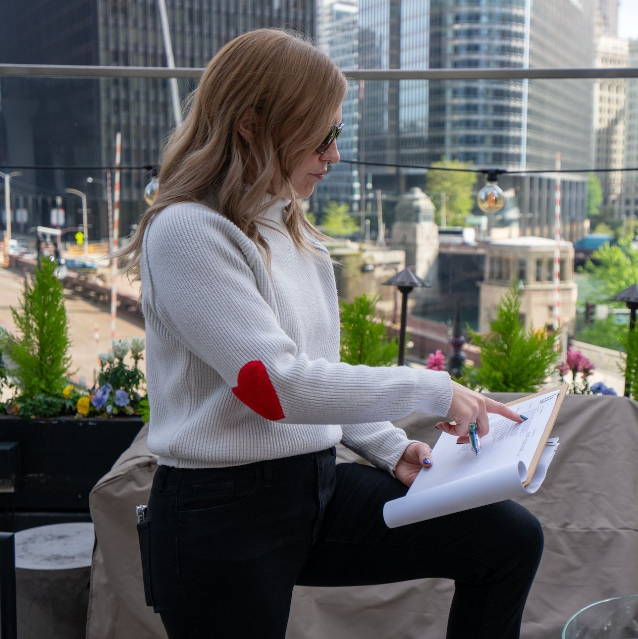 Event producer reviewing show notes and logistics while preparing for a corporate event.