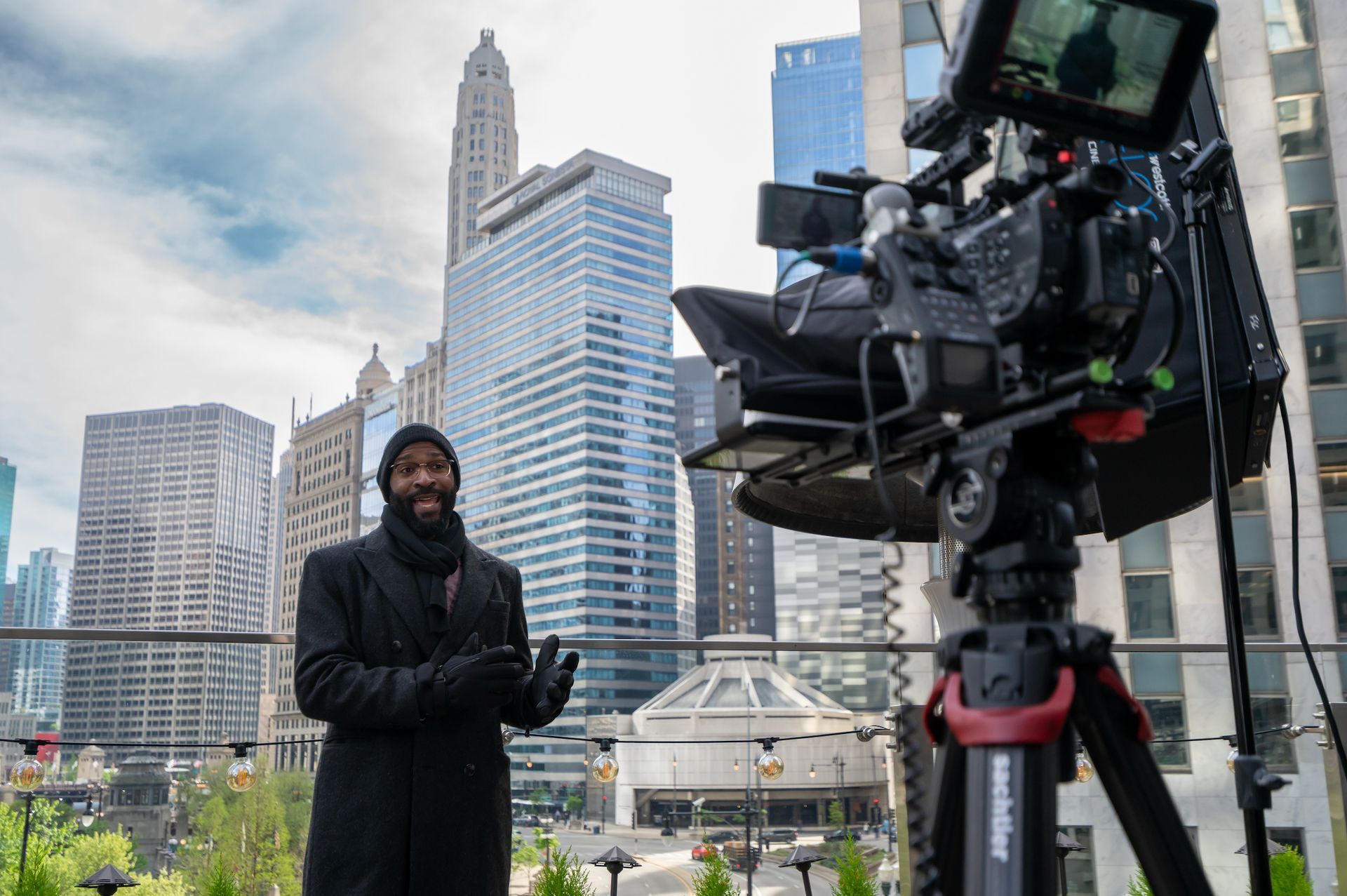 On-location video production featuring a presenter filming branded content in downtown Chicago.