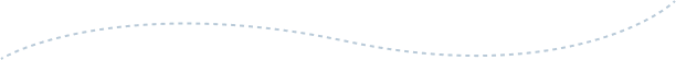A blurry, light-colored, curved line on a white background.