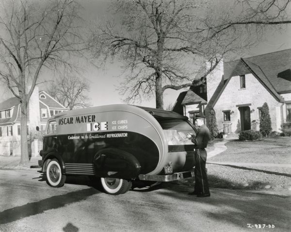 A black and white photo of a polar mayer ice truck