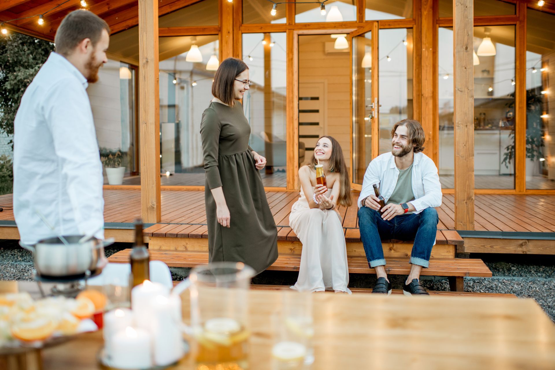 friends having fun on a newly designed custom deck built by Charlotte Deck Repair