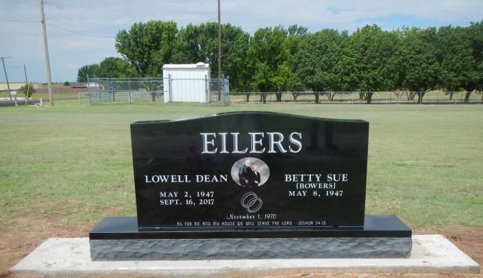 Black EILERS family gravestone in a grassy cemetery with trees in the background