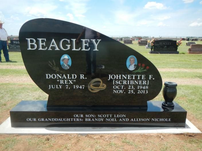 Beagley family gravestone in a cemetery with names and dates engraved on a black stone marker