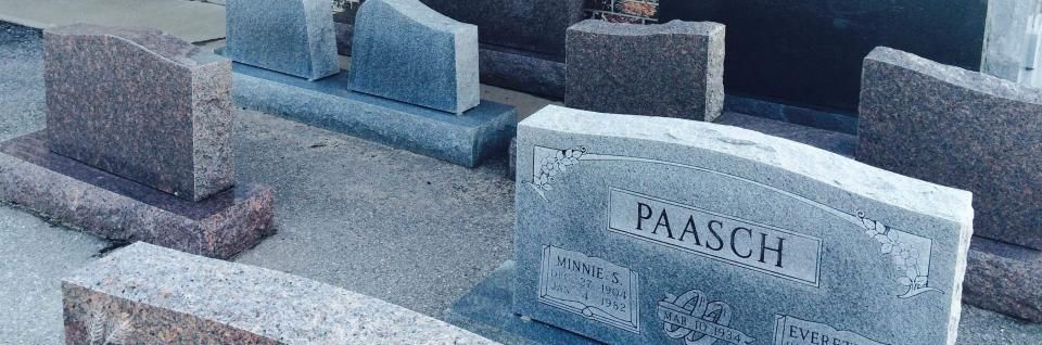 Small cemetery with several weathered gravestones, including one marked “JAASCH.”