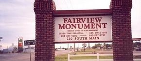 Fairview Monument sign on a brick entrance, with “72 South Main” and a street view in the background