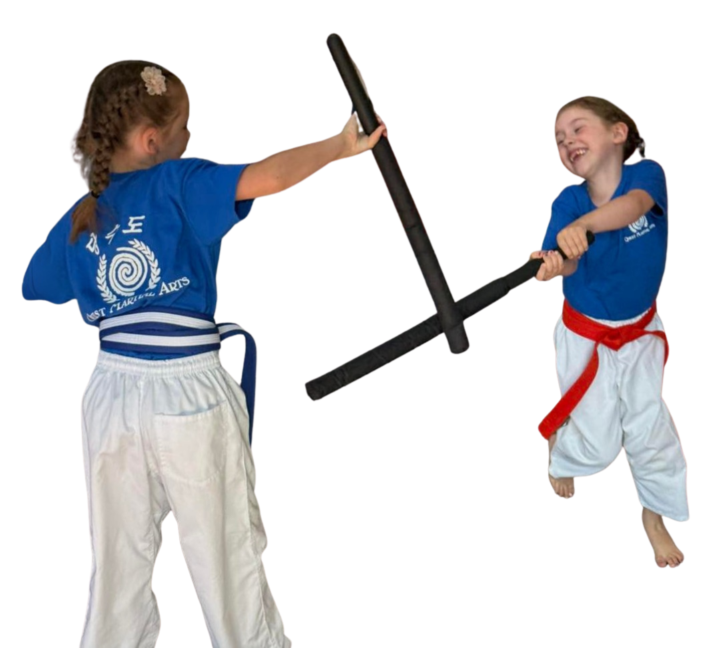 a group of children in karate uniforms are sitting on the floor drinking water .