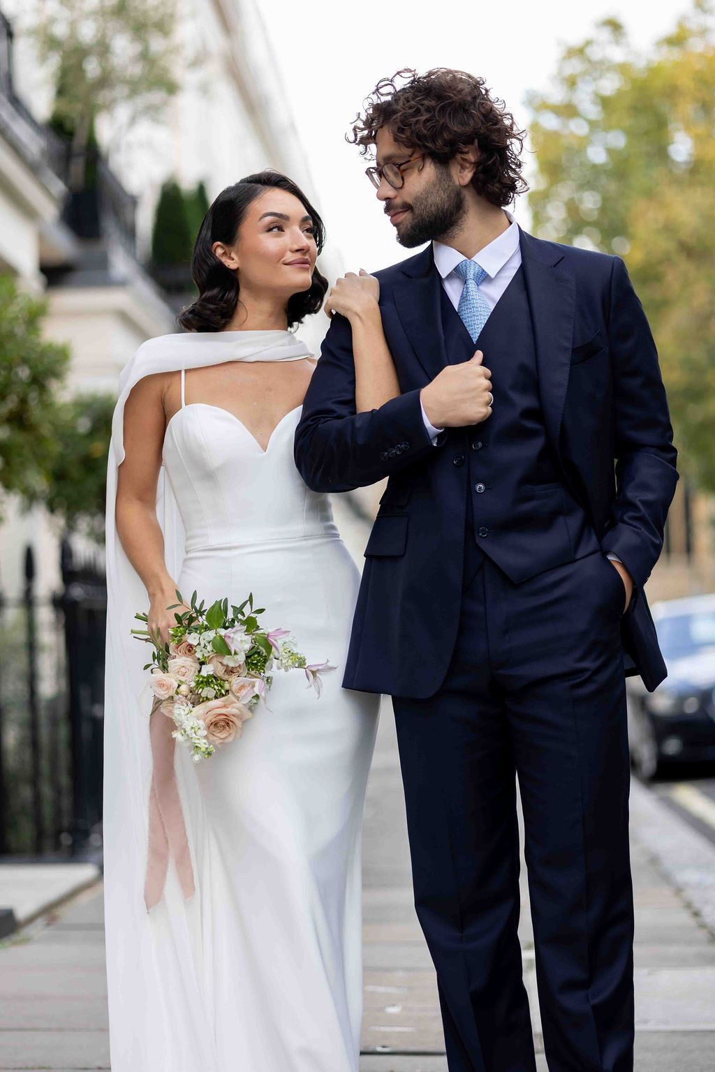 Groom wearing a Edward George Tailoring navy blue three piece suit for his wedding