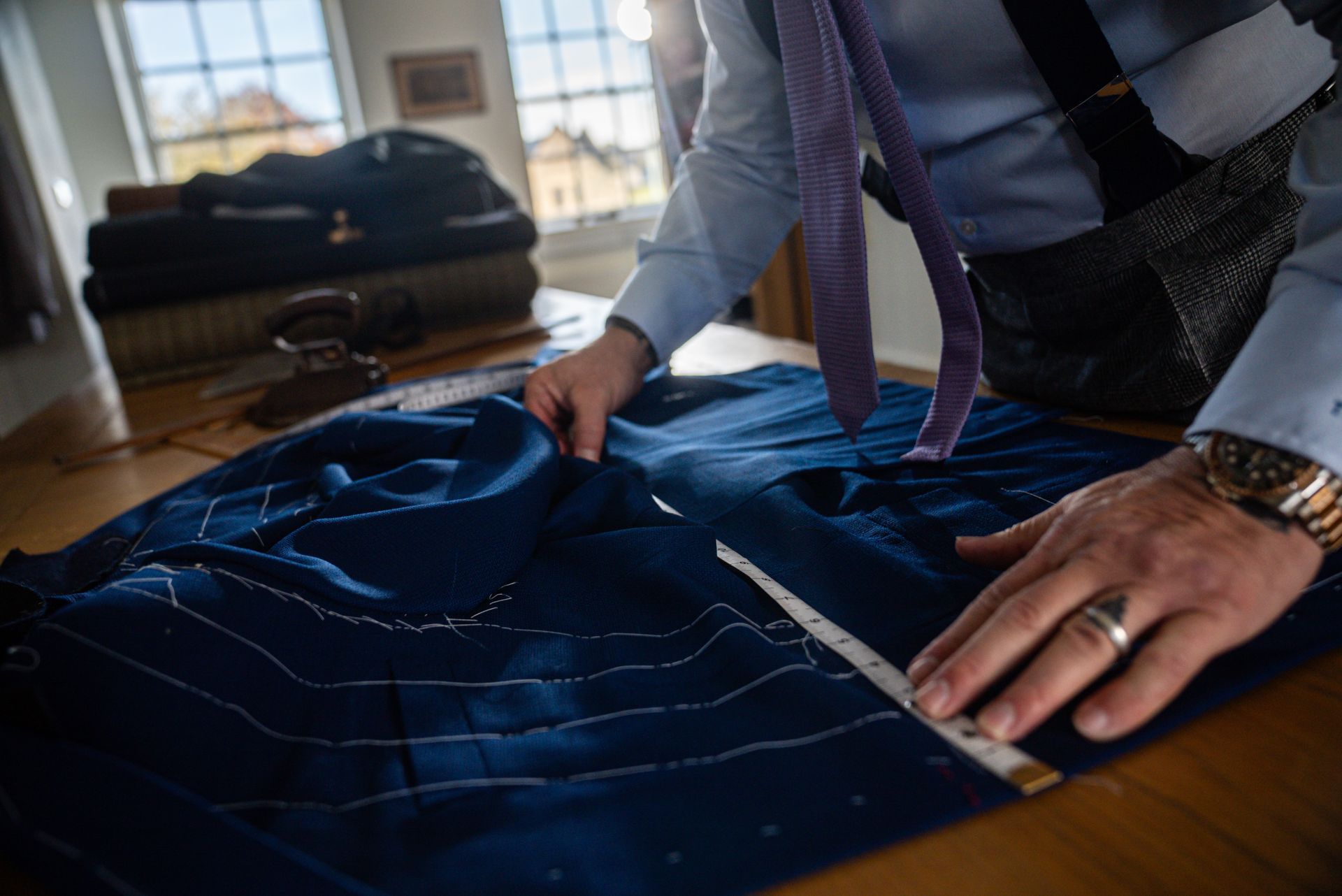 Edward George Bespoke tailor working on a bespoke jacket