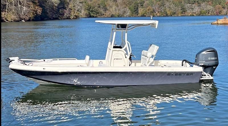 A boat is floating on top of a body of water.