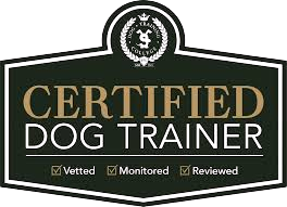 Certified Dog Trainer badge with gold and white text on a black shield, marked vetted, monitored, reviewed