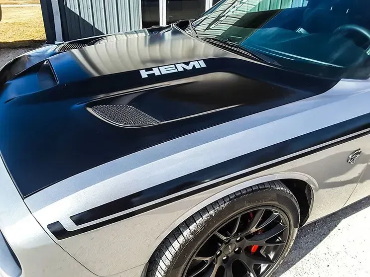 A close up of the hood of a dodge challenger.