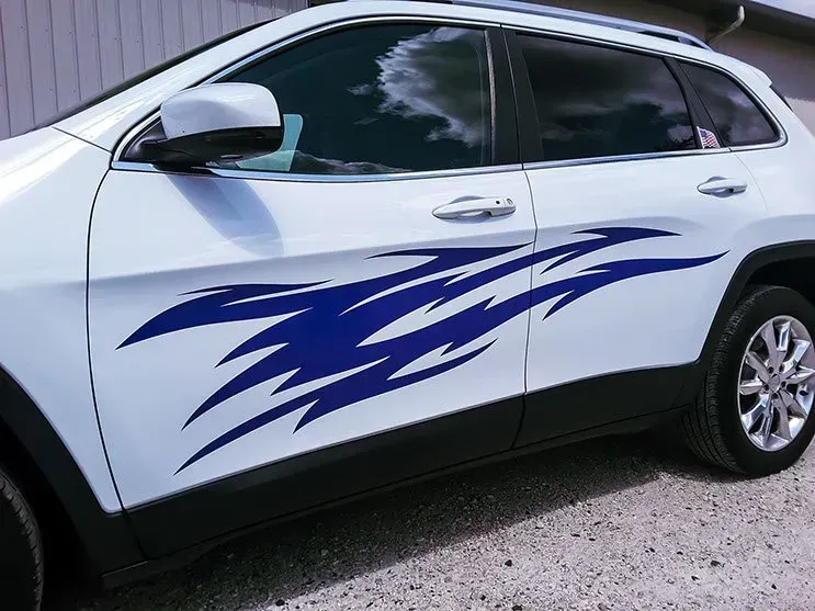 A white car with a blue design on the side