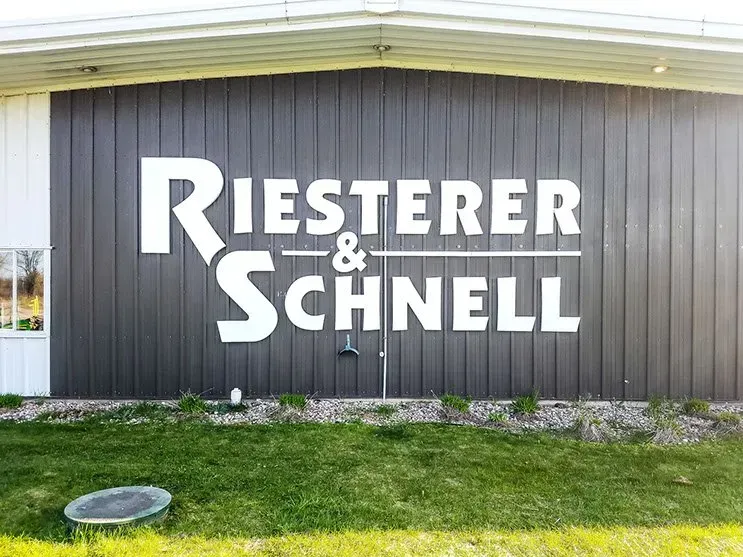 Riester & schnell is written on the side of a building.