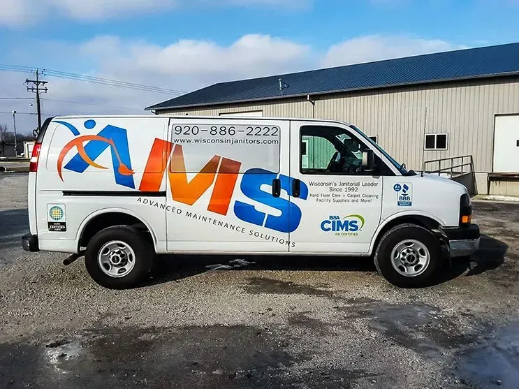 A white van with the word cims on it