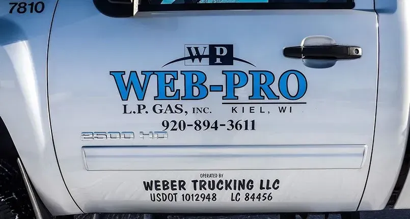 A white truck with web-pro written on the door