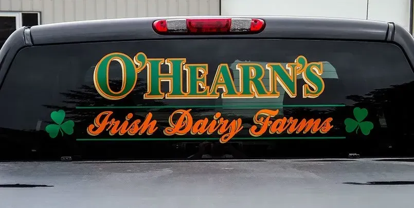 The back window of a truck says o'hearn 's irish dairy farms
