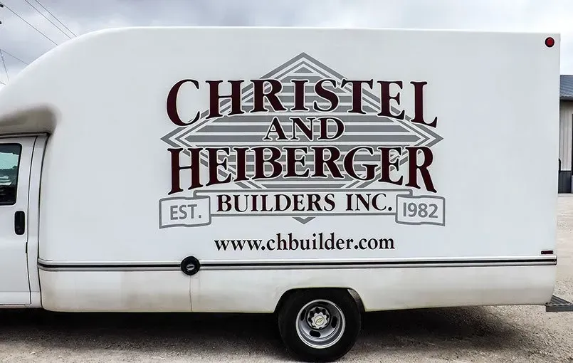 A white truck with christel and heiberger written on it