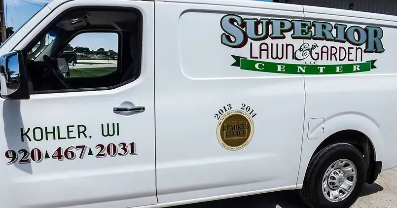 A white van with superior lawn and garden written on it