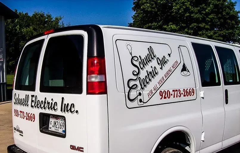 A white van for south electric inc. is parked in front of a house